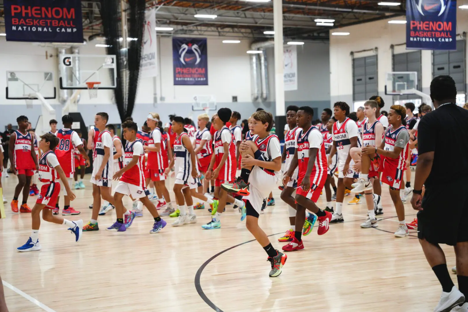 Some basket ball players doing exercise in the court